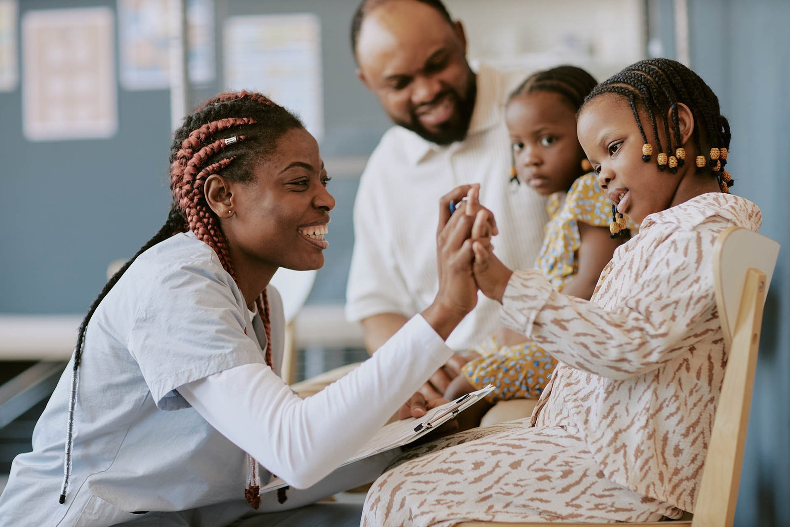 Caring Nurse Engaging with Child Using Educational Toys